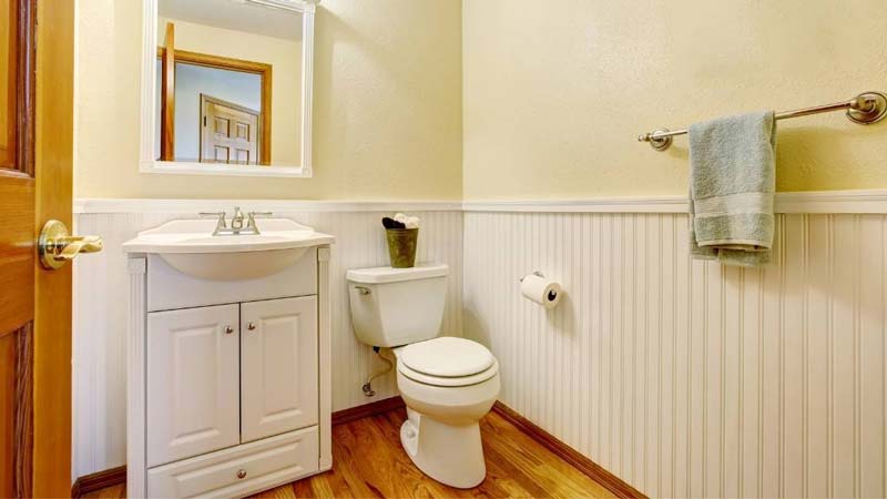 Single Vanities with a toilet in a bathroom
