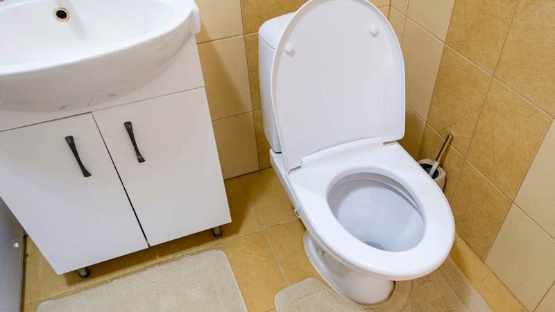 Compact design toilet in bathroom corner side for space save